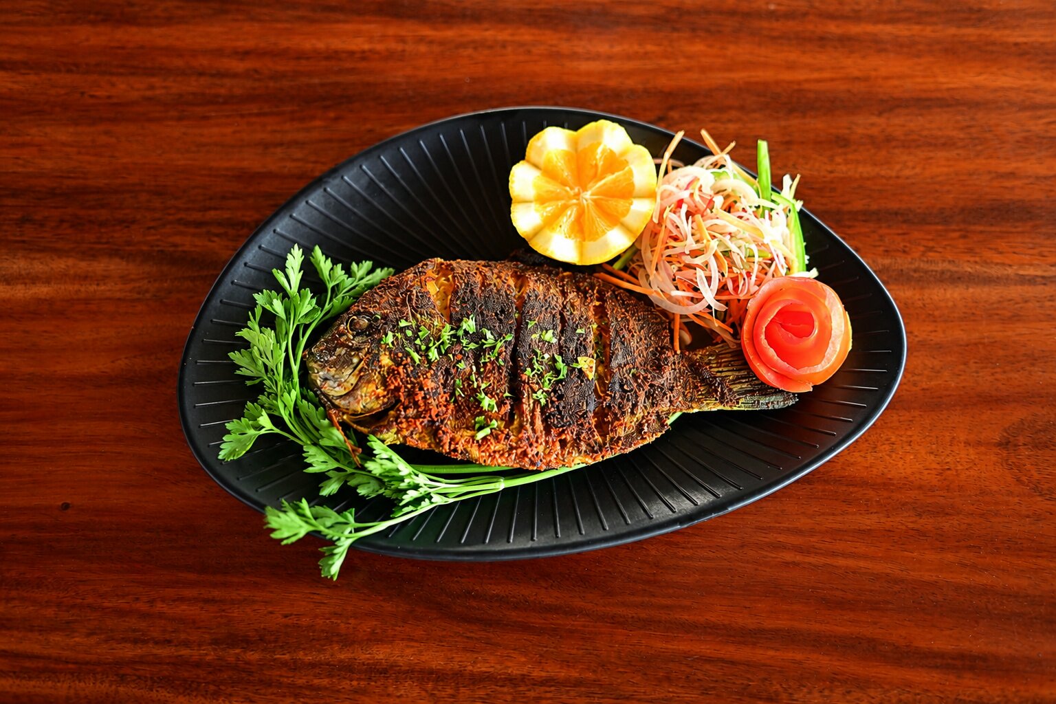 Spiced whole fish with citrus salad